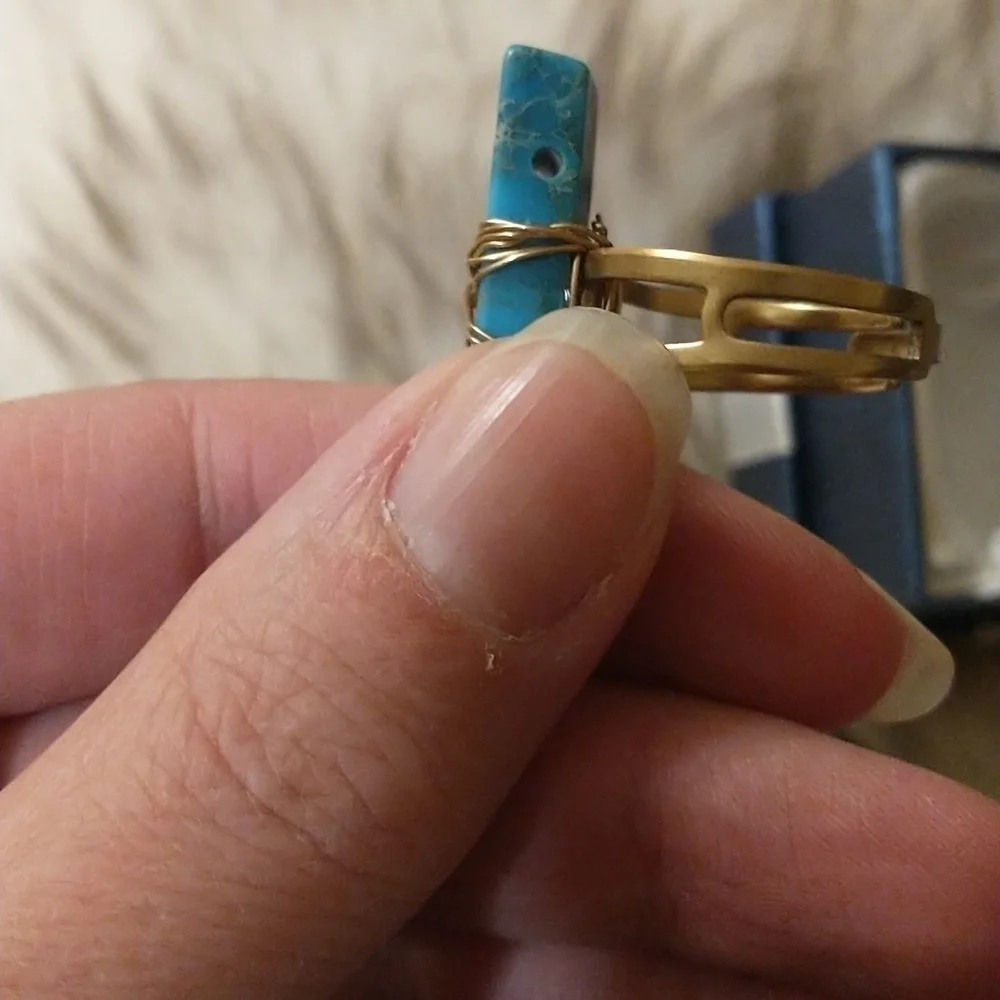Super cute gold wire wrapped faux turquoise adjustable ring.